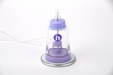 Purple baby bottle device with a clear top on a white background