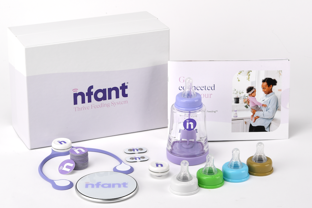 nfant baby product set including bottles and a stethoscope on a white background